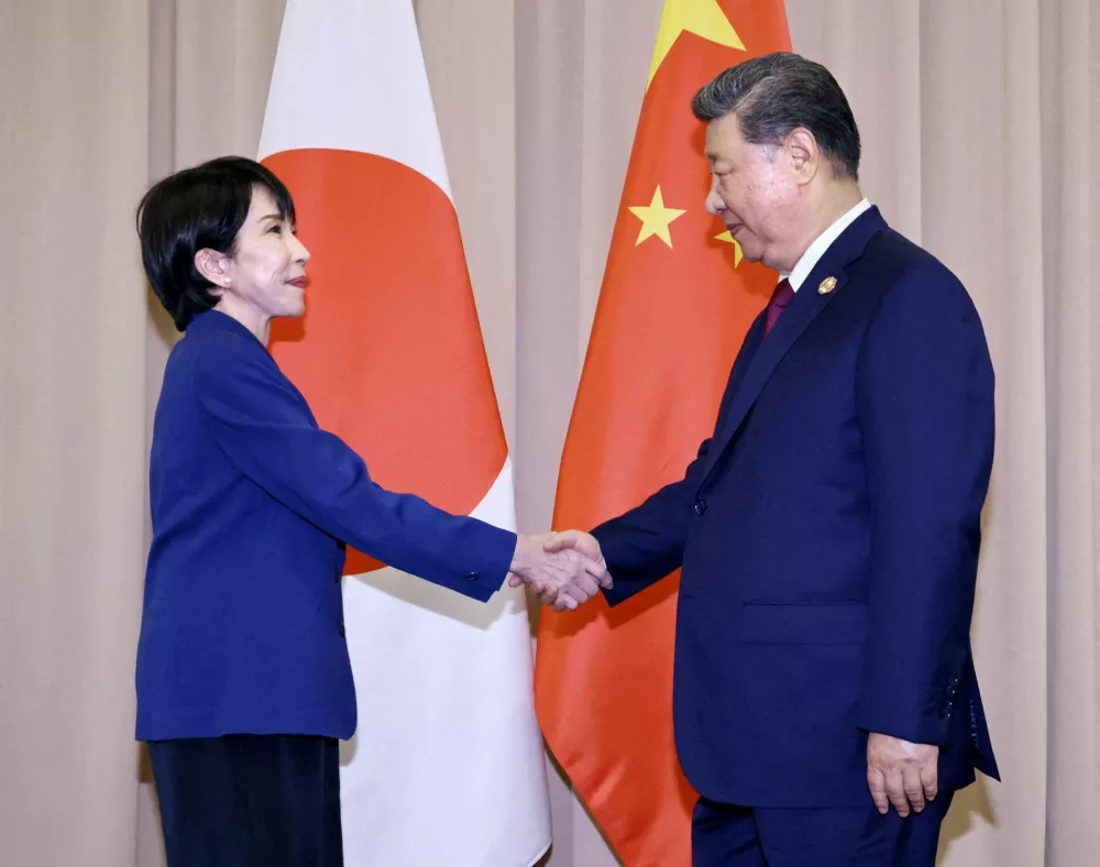FILE PHOTO: Japanese Prime Minister Sanae Takaichi shakes hands with Chinese President Xi Jinping ahead of their talks in Gyeongju, South Korea, October 31, 2025 in this photo distributed by Kyodo. Mandatory credit Kyodo/via ATTENTION EDITORS - FOR EDITORIAL USE ONLY. NOT FOR SALE FOR MARKETING OR ADVERTISING CAMPAIGNS. MANDATORY CREDIT. JAPAN OUT. NO COMMERCIAL OR EDITORIAL SALES IN JAPAN. THIS IMAGE WAS PROCESSED BY REUTERS TO ENHANCE QUALITY, AN UNPROCESSED VERSION WILL BE PROVIDED SEPARATELY./File Photo