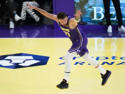 Los Angeles Lakers guard Luka Doncic celebrates his three-point basket during the first half of an NBA Cup basketball game against the Los Angeles Clippers Tuesday, Nov. 25, 2025, in Los Angeles. (AP Photo/Jae C. Hong)