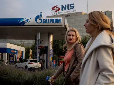 FILE PHOTO: People walk past a petrol station of the Russian oil producer Gazprom Neft, which is the major stakeholder in Serbian oil company NIS, in Belgrade, Serbia, October 8, 2025. REUTERS/Marko Djurica/File Photo