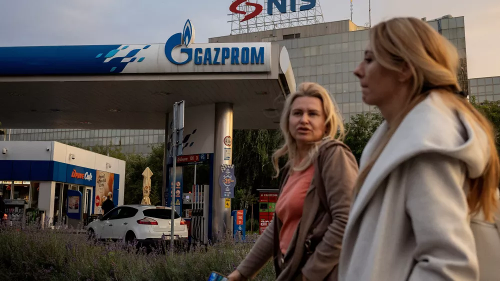 FILE PHOTO: People walk past a petrol station of the Russian oil producer Gazprom Neft, which is the major stakeholder in Serbian oil company NIS, in Belgrade, Serbia, October 8, 2025. REUTERS/Marko Djurica/File Photo