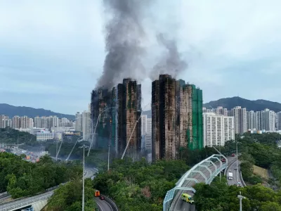 A drone view shows flames and thick smoke rising from the Wang Fuk Court housing estate during a major fire, in Tai Po, Hong Kong, China, November 27, 2025. REUTERS/Tyrone Siu   TPX IMAGES OF THE DAY