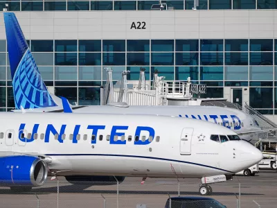 United Airlines jetliners maneuver open gates on the A concourse at Denver International airport Tuesday, Nov. 25, 2025, in Denver. (AP Photo/David Zalubowski)