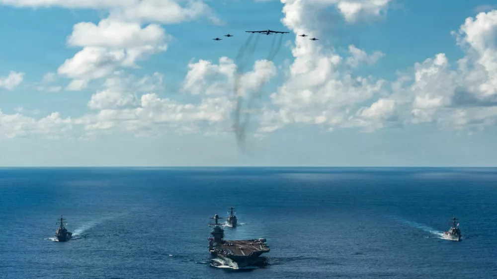 FILE PHOTO: The U.S. Navy's Gerald R. Ford Carrier Strike Group, including the flagship USS Gerald R. Ford, USS Winston S. Churchill, USS Mahan and USS Bainbridge, sail towards the Caribbean Sea under F/A-18E/F Super Hornets and a U.S. Air Force B-52 Stratofortress, in the Atlantic Ocean November 13, 2025. U.S. Navy/Petty Officer 3rd Class Gladjimi Balisage/Handout via REUTERS. THIS IMAGE HAS BEEN SUPPLIED BY A THIRD PARTY/File Photo