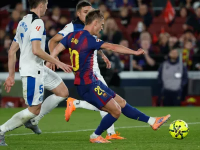 Barcelona's Dani Olmo scores his side's third goal during a Spanish La Liga soccer match between Barcelona and Alaves, in Barcelona, Spain, Saturday, Nov. 29, 2025. (AP Photo/Joan Monfort)