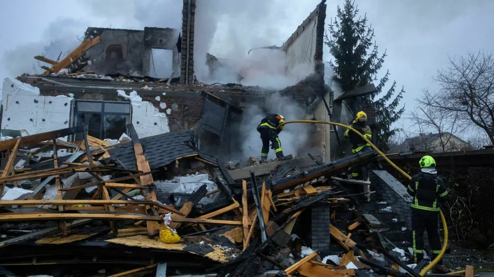 Firefighters work at the site of a private home that went up in flames after it was hit by a Russian drone during a night of attacks on Kyiv, amid Russia's attack on Ukraine, November 29, 2025. REUTERS/Thomas Peter    TPX IMAGES OF THE DAY