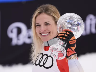 Switzerland's Lara Gut-Behrami holds the first place trophy for women's super-G season champion at the World Cup Finals, Sunday, March 23, 2025, in Sun Valley, Idaho. (AP Photo/John Locher)