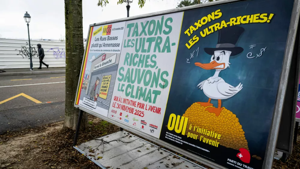 A person walks by referendum posters of political parties and associations as Swiss voters are casting ballots to decide whether women, like men, must do national service in the military, civil protection teams or in other forms, in Geneva, Switzerland, on Nov. 26, 2025. (Martial Trezzini/Keystone via AP)