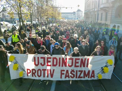 People carry a banner reading: "United against fascism" during a protest against what they say is the rising use of far-right symbols and rhetoric, in Zagreb, Croatia, November 30, 2025. REUTERS/Antonio Bronic