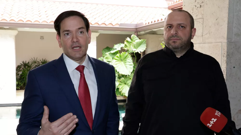 Secretary of State Marco Rubio, left, and Rustem Umerov, Secretary of the National Security of Ukraine talk to the media Sunday, Nov. 30, 2025, in Hallandale Beach, Fla. (AP Photo/Terry Renna)