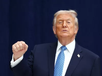 U.S. President Donald Trump gestures during a signing ceremony with President of the Democratic Republic of the Congo Felix Tshisekedi and President of Rwanda Paul Kagame at the U.S. Institute of Peace in Washington, D.C., U.S., December 4, 2025. REUTERS/Kevin Lamarque