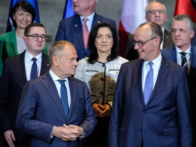 German Chancellor Friedrich Merz, front right, and Poland's Prime Minister Donald Tusk, front left, stand with Ministers of the German and Polish governments for a group photo after the German-Polish government consultations at the Chancellery in Berlin, Germany, Monday, Dec. 1, 2025. (AP Photo/Ebrahim Noroozi)