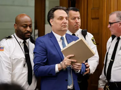 Brian Walshe is escorted into court for the afternoon session of the first day of the Brian Walshe murder trial in Norfolk Superior Court, Monday, Dec. 1, 2025, in Dedham, Mass. (Greg Derr/The Patriot Ledger via AP, Pool)