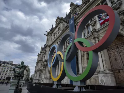 FILE - The Olympic rings are seen in front of the Paris City Hall, in Paris, on April 30, 2023. Paris City Hall said Wednesday Feb. 28, 2024 that no policing plans for the upcoming Olympic Games were lost in the theft of computer gear reported by one of its employees. (AP Photo/Aurelien Morissard, File)