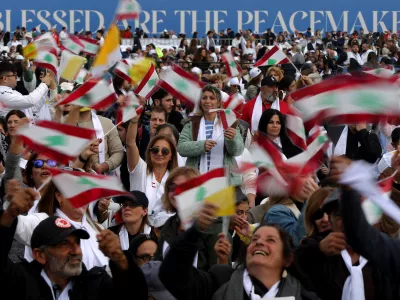 02 December 2025, Lebanon, Beirut: Lebanese believers attend a mass prayer conducted by Pope Leo XIV in Beirut at the end of his visit to Lebanon. Photo: Marwan Naamani/dpa