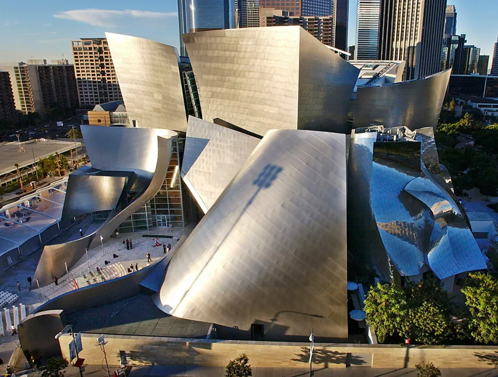 FILE - This Oct. 20, 2003 file photo shows early morning sun illuminating the new Walt Disney Concert Hall in downtown Los Angeles. (AP Photo/Nick Ut, file)