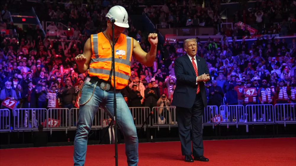 President-elect Donald Trump dances with The Village People at a rally ahead of the 60th Presidential Inauguration, Jan. 19, 2025, in Washington. (AP Photo/Evan Vucci, File)