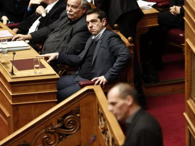 ﻿Greek Prime Minister Alexis Tsipras (C) listens to the speech of Greek Finance Minister Yanis Varoufakis (bottom) before a vote of confidence at the parliament in Athens February 10, 2015. Athens is not seeking a clash with its European partners but cannot exclude one, Varoufakis told parliament on the eve of a crucial euro zone finance ministers' meeting to discuss the country's future. REUTERS/Alkis Konstantinidis (GREECE - Tags: POLITICS BUSINESS)