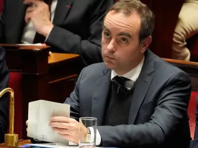 French Prime Minister Sebastien Lecornu looks on at France's National Assembly as parliament members vote on a national health care budget that would suspend Macron's unpopular pension reform raising the retirement age, in Paris, France, Tuesday, Dec. 9, 2025. (AP Photo/Michel Euler)