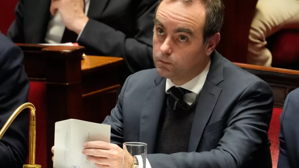 French Prime Minister Sebastien Lecornu looks on at France's National Assembly as parliament members vote on a national health care budget that would suspend Macron's unpopular pension reform raising the retirement age, in Paris, France, Tuesday, Dec. 9, 2025. (AP Photo/Michel Euler)