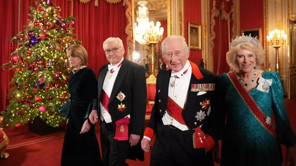 03 December 2025, United Kingdom, Windsor: UK King Charles III and Queen Camilla (R) arrive with German President Frank-Walter Steinmeier and his wife Elke Buedenbender ahead of the state banquet for the German President and his wife, at Windsor Castle, on day one of their state visit to the UK. Photo: Carlos Jasso/PA Wire/dpa