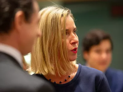 FILE -European Union foreign policy chief Federica Mogherini, right, attends a meeting of EU foreign ministers at the EU Council building in Brussels, Nov. 25, 2019. (AP Photo/Virginia Mayo, File)