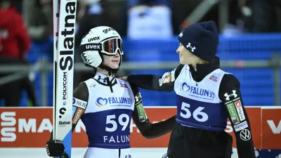 Nika Prevc, of Slovenia, left, and Nika Vodan, of Slovenia, react after completing the women's Individual HS95 FIS World Cup Ski Jumping event in Falun, Sweden, Friday, Nov. 28, 2025. (Fredrik Sandberg/TT News Agency via AP)