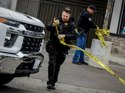Investigators with the San Joaquin Sheriff's Department remove crime scene tape at Thornton Blvd. and Lucile Ave., where a mass shooting took place Saturday in a banquet hall in Stockton, Calif., Sunday, Nov. 30, 2025. (Brontë Wittpenn/San Francisco Chronicle via AP)