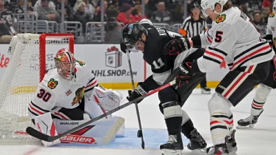 Dec 4, 2025; Los Angeles, California, USA; Chicago Blackhawks defenseman Connor Murphy (5) uses his stick to defend Los Angeles Kings center Anze Kopitar (11) as Chicago Blackhawks goaltender Spencer Knight (30) defends the net during the second period at Crypto.com Arena. Mandatory Credit: Jayne Kamin-Oncea-Imagn Images