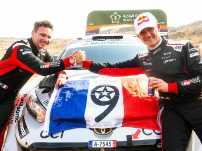 Sébastien Ogier secured his ninth FIA World Rally Championship title after a decisive Asfan surge put the championship in his hands, equalling Sébastien Loeb's record and earning co-driver Vincent Landais his first world crown. Thierry Neuville clinched his first win of the season in Saudi Arabia by 54.7 seconds, while Elfyn Evans missed the title by just four points in one of the closest finishes in recent WRC history. // Sébastien Ogier (FRA) and Vincent Landais (FRA) of team TOYOTA GAZOO RACING WRT celebrate World Rally Championship 2025 title during stop 14 of the World Rally Championship in Jeddah, Saudi Arabia on November 29, 2025. // Jaanus Ree / Red Bull Content Pool via AP Images // For more content, pictures and videos like this please go to http://www.redbullcontentpool.com