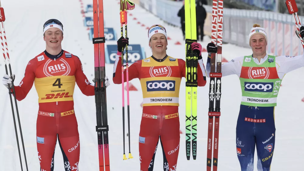 05 December 2025, Norway, Trondheim: Norway's winner Johannes Hoesflot Klaebo (C), second-placed Oskar Opstad Vike (L) and Sweden's third-placed Alvar Myhlback, celebrate after the Men's Sprint Final Classic competition during the FIS Cross-Country World Cup in Trondheim. Photo: Geir Olsen/NTB/dpa