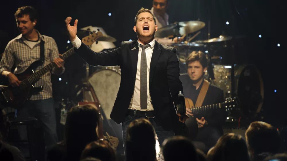 Singer Michael Buble performs songs from his new album "Christmas" at an iHeartRadio Live show at the P.C. Richard & Son Theater in New York, Tuesday, Nov. 8, 2011. (AP Photo/iHeartRadio, Chris Owyoung)