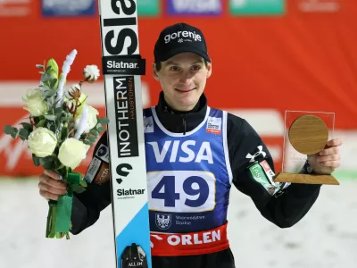 Ski Jumping - FIS Ski Jumping World Cup - Wisla, Poland - December 6, 2025 Slovenia's Domen Prevc celebrates on the podium after winning the Men's Individual Large Hill REUTERS/Kacper Pempel