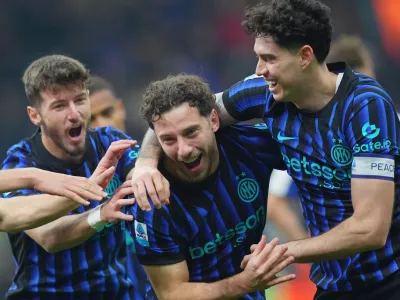 06 December 2025, Italy, Milan: Inter Milan's Carlos Augusto celebrates scoring his side's fourth goal during the Italian Serie A soccer match between Inter Milan and Como 1907 at San Siro Stadium. Photo: Spada/LaPresse via ZUMA Press/dpa