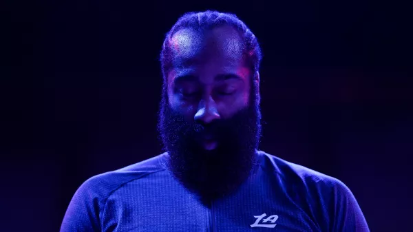 Los Angeles Clippers guard James Harden (1) stands during the national anthem before an NBA basketball game against the Minnesota Timberwolves Saturday, Dec. 6, 2025, in Minneapolis. (AP Photo/Matt Krohn)