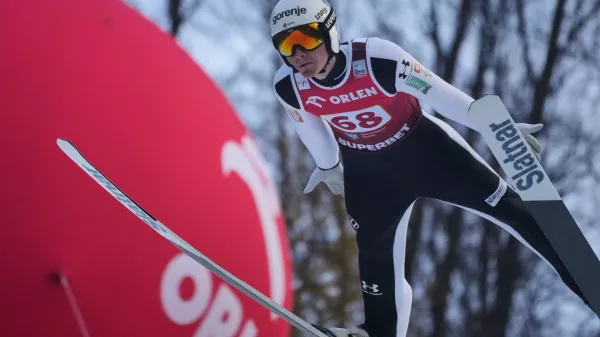 Domen Prevc of Slovenia soars through the air during his first round jump of the ski jumping Men's Large Hill HS134 event at the FIS Ski Jumping World Cup in Wisla, Poland, Sunday, Dec. 7, 2025. (AP Photo/Czarek Sokolowski)