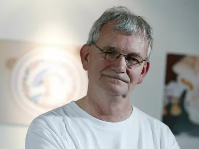 FILE PHOTO: Photographer Martin Parr poses for a photograph during the presentation of the House of Holland Spring/Summer 2015 collection during "London Collections: Men" in London, Britain June 14, 2015. REUTERS/Suzanne Plunkett/File Photo