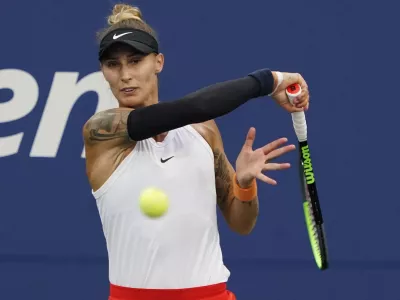 ﻿Polona Hercog, of Slovenia, strikes the ball during the first round of the US Open tennis championships, Tuesday, Aug. 31, 2021, in New York. (AP Photo/Elise Amendola)