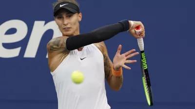 ﻿Polona Hercog, of Slovenia, strikes the ball during the first round of the US Open tennis championships, Tuesday, Aug. 31, 2021, in New York. (AP Photo/Elise Amendola)