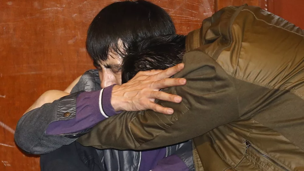 Family members of passengers aboard Malaysia Airlines MH370 cry after watching a television broadcast of a news conference, in the Lido hotel in Beijing, March 24, 2014. The Malaysia Airlines plane that disappeared over two weeks ago crashed in the southern Indian Ocean, Malaysia's Prime Minister Najib Razak said on Monday. REUTERS/Kim Kyung-Hoon (CHINA - Tags: TRANSPORT DISASTER)