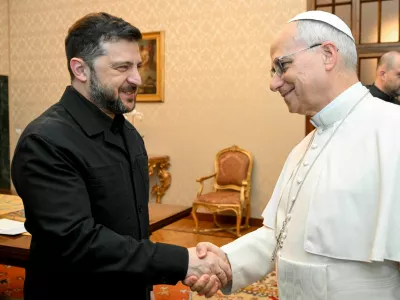 Pope Leo XIV and Ukraine's President Volodymyr Zelenskiy shake hands at Villa Barberini in Castel Gandolfo, Italy, December 9, 2025.  Vatican Media/&shy;Simone Risoluti/Handout via REUTERS  ATTENTION EDITORS - THIS IMAGE WAS PROVIDED BY A THIRD PARTY.   TPX IMAGES OF THE DAY