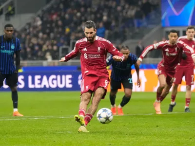 Liverpool's Dominik Szoboszlai scores his side's first goal from a penalty shot during a Champions League, league phase, soccer match between Inter Milan and Liverpool in Milan, Italy, Tuesday, Dec.9, 2025. (AP Photo/Luca Bruno)