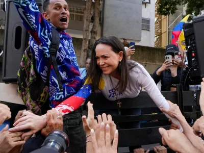 FILE - Opposition leader Maria Corina Machado greets supporters during a protest against Venezuelan President Nicolas Maduro the day before his inauguration for a third term in Caracas, Venezuela, Thursday, Jan. 9, 2025. (AP Photo/Matias Delacroix, file)