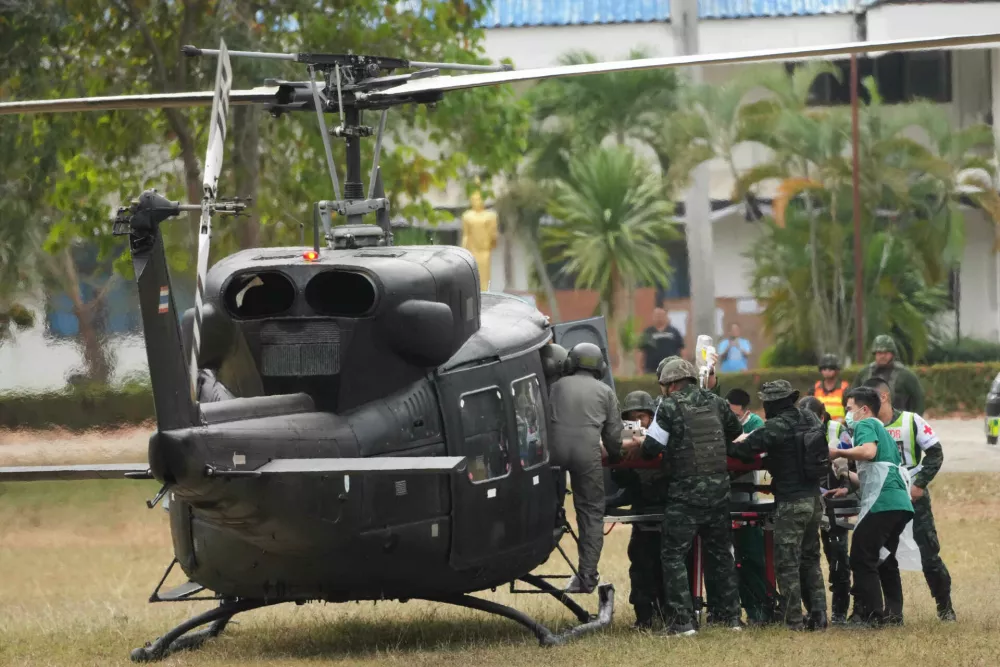 An wounded Thai soldier is carried to be transferred to a hospital, in Surin province, Thailand, Wednesday, Dec. 10, 2025, following clashes between Thai and Cambodian soldiers. (AP Photo/Sakchai Lalit)