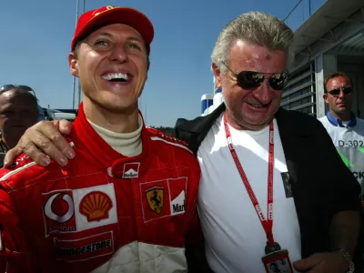 German Formula One World Champion Michael Schumacher (L) is hugged byhis manager Willi Weber after his German Grand Prix victory at theHockenheim race track July 28, 2002. Schumacher returned home in styleon Sunday, adding a rare and record-equalling German Grand Prix win tohis historic fifth Formula One title. REUTERS/Ralph OrlowskiMAD/GB