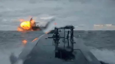 A Ukrainian sea drone shows the Dashan, a tanker part of Russia's so-called "shadow fleet", being struck by another sea drone in the Black Sea, December 10, 2025, in this picture obtained from a video. Shared by Security Service Official/Handout via REUTERS  THIS IMAGE HAS BEEN SUPPLIED BY A THIRD PARTY. Verification note: Reuters was able to verify the video showed the Dashan tanker by comparing the deck, cranes and structures with file imagery. The location and date were confirmed by the SBU source's account and ship tracking data.