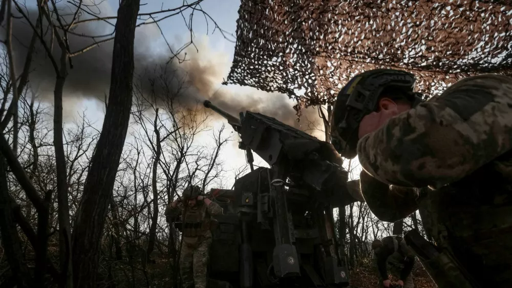 FILE PHOTO: Servicemen of the 148th Separate Artillery Zhytomyr Brigade of the Armed Forces of Ukraine fire a Caesar self-propelled howitzer towards Russian troops at a position on the front line, amid Russia's attack on Ukraine, near the frontline town of Pokrovsk in Donetsk region, Ukraine November 23, 2025. REUTERS/Anatolii Stepanov/File Photo