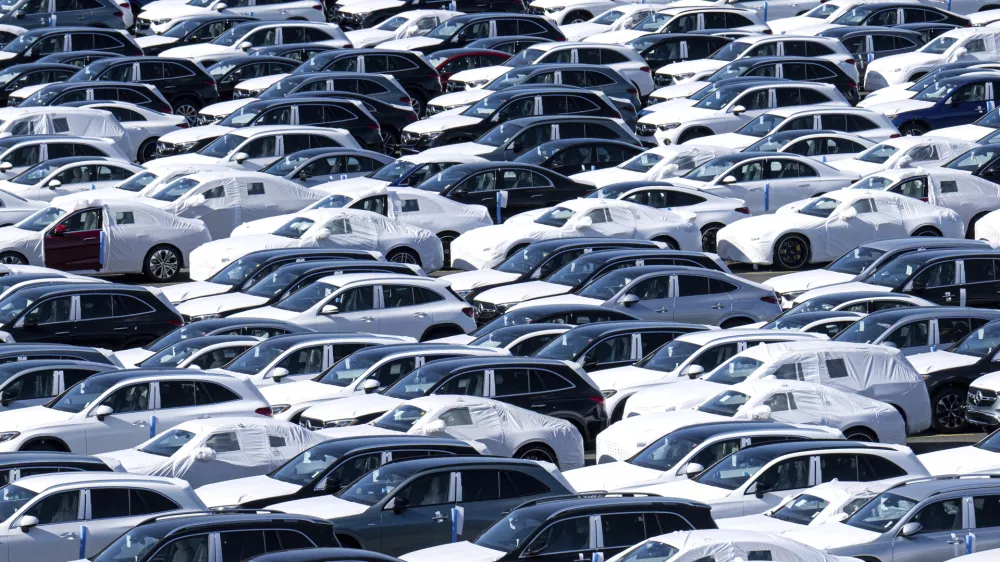 Cars are lined up before being loaded onto ships in the port at BLG Autoterminal Bremerhaven, Germany, Tuesday, April 1, 2025. (Sina Schuldt/dpa via AP)
