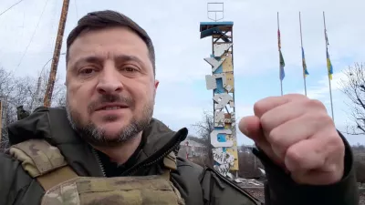 In this grab from a video provided by the Press Service Of The President Of Ukraine on Friday, Dec 12, 2025, Ukraine's President Volodymyr Zelenskyy records a video at the road entering of Kupiansk, Ukraine. (Press Service Of The President Of Ukraine via AP)