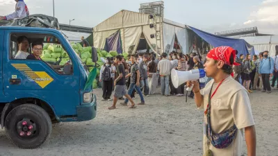 11 December 2025, Cambodia, Phnom Penh: Young people rally at an aid collection centre, sorting and loading provisions onto trucks bound for conflict-affected areas along the Cambodian-Thai border. Photo: Rod Harbinson/ZUMA Press Wire/dpa