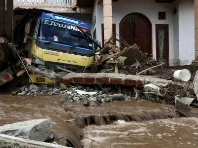 FILE PHOTO: A damaged vehicle sits amongst debris after deadly landslides following heavy rains in Malalak, Agam regency, West Sumatra province, Indonesia, December 3, 2025. REUTERS/Willy Kurniawan/File Photo